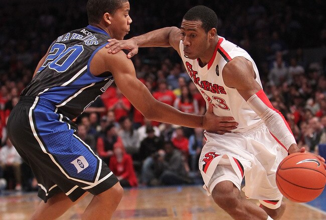 NEW YORK, NY - JANUARY 30: Paris Horne #23 of the St. John's Red Storm dribbles the ball against Andre Dawkins #20 of the Duke Blue Devils  at Madison Square Garden on January 30, 2011 in New York City.  (Photo by Nick Laham/Getty Images)