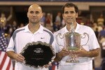 FLUSHING, NY - SEPTEMBER 8: Andre Agassi and Pete Sampras pose for photographers after their match during the final of the US Open September 8, 2002 at the USTA National Tennis Center in Flushing Meadows Corona Park in Flushing, New York.  (Photo by Ezra Shaw/Getty Images)