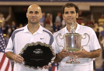 FLUSHING, NY - SEPTEMBER 8: Andre Agassi and Pete Sampras pose for photographers after their match during the final of the US Open September 8, 2002 at the USTA National Tennis Center in Flushing Meadows Corona Park in Flushing, New York. (Photo by Ezra Shaw/Getty Images)
