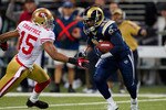 ST. LOUIS, MO - DECEMBER 26: Oshiomogho Atogwe #21 of the St. Louis Rams returns an interception against Michael Crabtree #15 of the San Francisco 49ers at the Edward Jones Dome on December 26, 2010 in St. Louis, Missouri. The Rams beat the 49ers 25-17. (Photo by Dilip Vishwanat/Getty Images)
