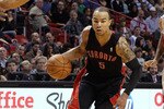 MIAMI, FL - JANUARY 22:  Jerryd Bayless #5 of the Toronto Raptors dribbles past Eddie House #55 of the Miami Heat during a game at American Airlines Arena on January 22, 2011 in Miami, Florida. NOTE TO USER: User expressly acknowledges and agrees that, by downloading and/or using this Photograph, User is consenting to the terms and conditions of the Getty Images License Agreement.  (Photo by Mike Ehrmann/Getty Images)