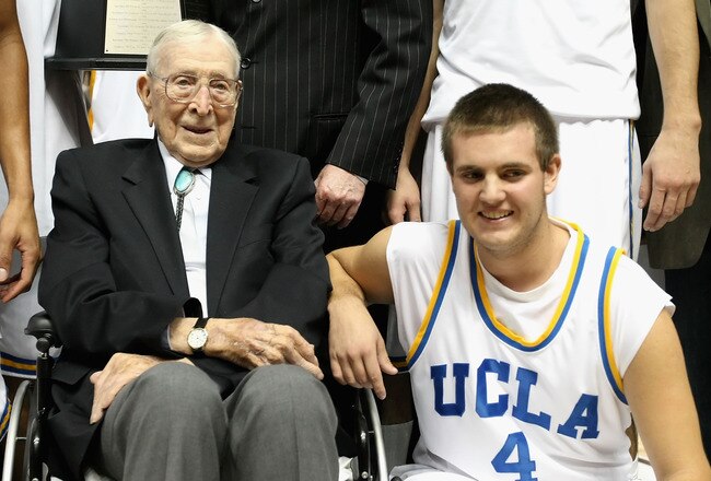 ANAHEIM, CA - DECEMBER 13:  Former coach John Wooden poses with great grandson Tyler Trapani #4 of the UCLA Bruins after the John R. Wooden Classic game against the DePaul Blue Demons at Honda Center on December 13, 2008 in Anaheim, California. The Bruins defeated the Blue Demons 72-54.  (Photo by Christian Petersen/Getty Images)