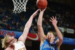 BIRMINGHAM, AL - MARCH 21:  Ben McGonagil #41 of the North Carolina-Asheville Bulldogs shoots over Brad Buckman #22 of the University of Texas Longhorns during the first round of the South Region NCAA Tournament at the Birmingham Civic Center on March 21, 2003 in Birmingham, Alabama.  Texas defeated UNC Asheville 82-61.  (Photo by Jamie Squire/Getty Images)
