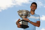 MELBOURNE, AUSTRALIA - JANUARY 31:  Novak Djokovic of Serbia poses with the Norman Brookes Challenge Cup at the Melbourne Cricket Ground on January 31, 2011 in Melbourne, Australia.  (Photo by Mark Dadswell/Getty Images)