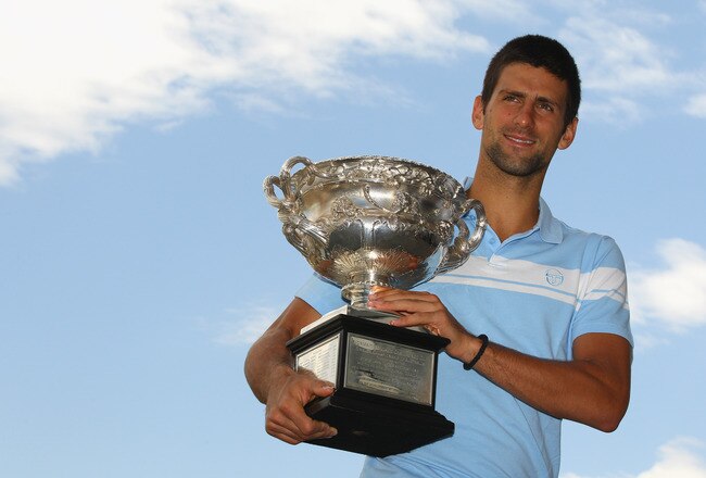 MELBOURNE, AUSTRALIA - JANUARY 31:  Novak Djokovic of Serbia poses with the Norman Brookes Challenge Cup at the Melbourne Cricket Ground on January 31, 2011 in Melbourne, Australia.  (Photo by Mark Dadswell/Getty Images)