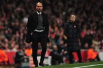 LONDON, ENGLAND - FEBRUARY 16:  Josep Guardiola, Coach of Barcelona watches with Arsene Wenger, Manager of Arsenal during the UEFA Champions League round of 16 first leg match between Arsenal and Barcelona at the Emirates Stadium on February 16, 2011 in London, England.  (Photo by Shaun Botterill/Getty Images)