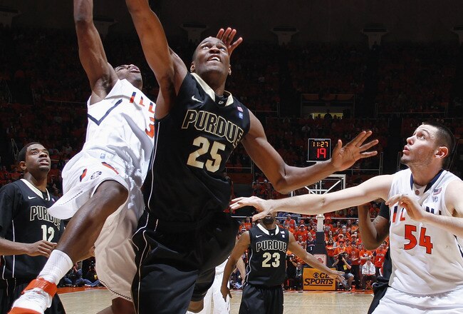 CHAMPAIGN, IL - FEBRUARY 13: JaJuan Johnson #25 of the Purdue Boilermakers goes to the basket against Brandon Paul #3 and Mike Tisdale #54 of the Illinois Fighting Illini at Assembly Hall on February 13, 2011 in Champaign, Illinois. Purdue defeated Illinois 81-70. (Photo by Joe Robbins/Getty Images)
