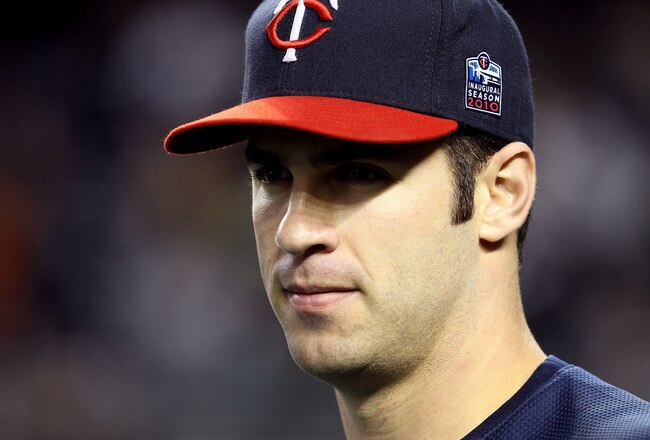 NEW YORK - OCTOBER 09:  Joe Mauer #7 of the Minnesota Twins looks on during batting practice against the New York Yankees during Game Three of the ALDS part of the 2010 MLB Playoffs at Yankee Stadium on October 9, 2010 in the Bronx borough of New York City.  (Photo by Jim McIsaac/Getty Images)