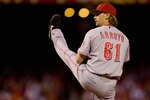 ST. LOUIS - SEPTEMBER 3: Starter Bronson Arroyo #61 of the Cincinnati Reds pitches against the St. Louis Cardinals at Busch Stadium on September 3, 2010 in St. Louis, Missouri.  (Photo by Dilip Vishwanat/Getty Images)