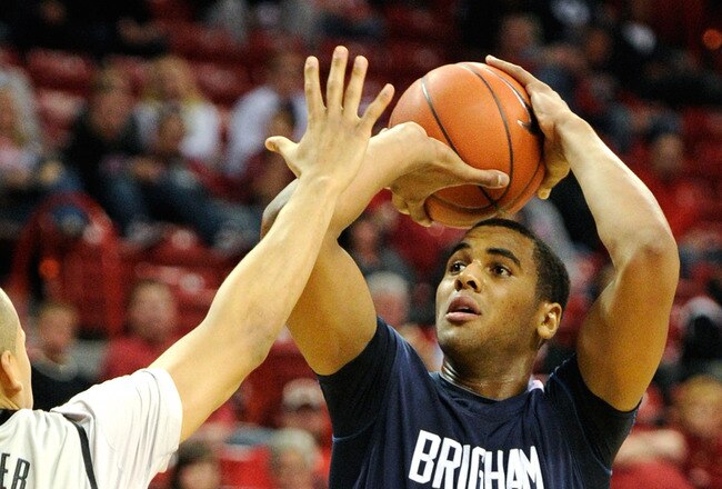 LAS VEGAS, NV - JANUARY 05:  Brandon Davies #0 of the Brigham Young University Cougars shoots against Derrick Jasper #5 of the UNLV Rebels during their game at the Thomas & Mack Center January 5, 2011 in Las Vegas, Nevada. BYU won 89-77.  (Photo by Ethan Miller/Getty Images)