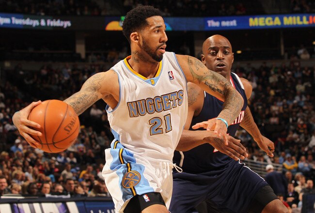 DENVER, CO - FEBRUARY 28:  Wilson Chandler #21 of the Denver Nuggets drives the ball against Damien Wilkens #3 of the Atlanta Hawks during NBA action at the Pepsi Center on February 28, 2011 in Denver, Colorado. NOTE TO USER: User expressly acknowledges and agrees that, by downloading and or using this photograph, User is consenting to the terms and conditions of the Getty Images License Agreement.  (Photo by Doug Pensinger/Getty Images)