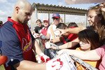 JUPITER, FL - FEBRUARY 17: Albert Pujols #5 #5 of the St. Louis Cardinals signs autographs for fans at Roger Dean Stadium on February 17, 2011 in Jupiter, Florida. (Photo by Joel Auerbach/Getty Images)