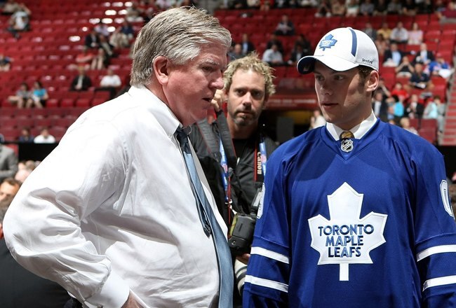 MONTREAL, QC - JUNE 27:  Kenny Ryan speaks to General Manager Brian Burke of the Toronto Maple Leafs organization after he was drafted by the Leafs in the second round during the 2009 NHL Entry Draft at the Bell Centre on June 27, 2009 in Montreal, Quebec, Canada. (Photo by Bruce Bennett/Getty Images)