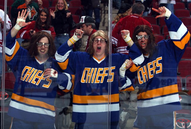 GLENDALE, AZ - JANUARY 14:  Fans dressed as the Hanson Brothers cheer along the boards following the NHL game between the New Jersey Devils and the Phoenix Coyotes at Jobing.com Arena on January 14, 2010 in Glendale, Arizona.  The Coyotes defeated the Devils 4-3.  (Photo by Christian Petersen/Getty Images)