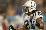 MIAMI GARDENS, FL - FEBRUARY 04:  Safety Bob Sanders #21 of the Indianapolis Colts celebrates after his tackle of Cedric Benson #32 of the Chicago Bears for the Colts to recover the fumble in the first quarter of Super Bowl XLI on February 4, 2007 at Dolphin Stadium in Miami Gardens, Florida.  (Photo by Donald Miralle/Getty Images)