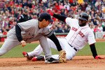 BOSTON - OCTOBER 3:  Mark Teixeira #25 of the New York Yankees executes the second out of a double play on base runner David Ortiz #34 of  the Boston Red Sox, who was caught off of first base, at Fenway Park, October 3, 2010, in Boston, Massachusetts. (Photo by Jim Rogash/Getty Images)