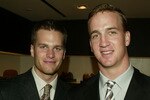 NEW YORK - APRIL13:  (L-R) NFL Quarterbacks Tom Brady and Peyton Manning attend the Ermenegildo Zegna Flagship store opening April 13, 2004 in New York City.  (Photo by Peter Kramer/Getty Images)
