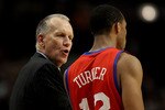 CHICAGO, IL - DECEMBER 21: Head coach Doug Collins of the Philadelphia 76ers gives instructions to Evan Turner #12 during a game against the Chicago Bulls at the United Center on December 21, 2010 in Chicago, Illinois. The Bulls defeated the 76ers 121-76. NOTE TO USER: User expressly acknowledges and agrees that, by downloading and/or using this photograph, User is consenting to the terms and conditions of the Getty Images License Agreement. (Photo by Jonathan Daniel/Getty Images)