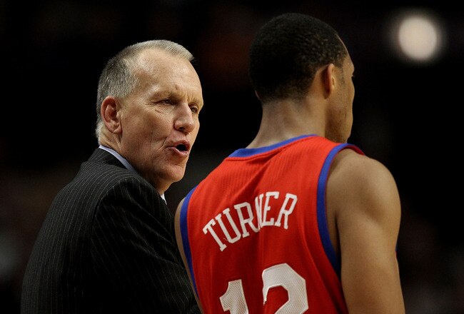 CHICAGO, IL - DECEMBER 21: Head coach Doug Collins of the Philadelphia 76ers gives instructions to Evan Turner #12 during a game against the Chicago Bulls at the United Center on December 21, 2010 in Chicago, Illinois. The Bulls defeated the 76ers 121-76. NOTE TO USER: User expressly acknowledges and agrees that, by downloading and/or using this photograph, User is consenting to the terms and conditions of the Getty Images License Agreement. (Photo by Jonathan Daniel/Getty Images)