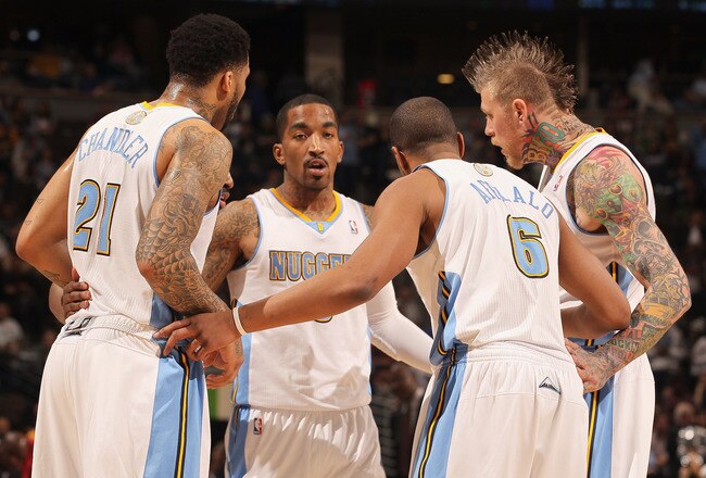 DENVER, CO - FEBRUARY 28:  (L-R) Wilson Chandler #21, Raymond Felton #20 (hidden), J.R. Smith #5, Arron Afflalo #6 and Chris Andersen #11 of the Denver Nuggets huddle up against the Atlanta Hawks during NBA action at the Pepsi Center on February 28, 2011 in Denver, Colorado. The Nuggets deafeated the Hawks 100-90. NOTE TO USER: User expressly acknowledges and agrees that, by downloading and or using this photograph, User is consenting to the terms and conditions of the Getty Images License Agreement.  (Photo by Doug Pensinger/Getty Images)