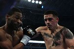ARLINGTON, TX - NOVEMBER 13:  Brandon Rios (R in brown trunks) lands a punch against Omri Lowther (red trunks) during their Super Lightweight bout at Cowboys Stadium on November 13, 2010 in Arlington, Texas.  (Photo by Nick Laham/Getty Images)