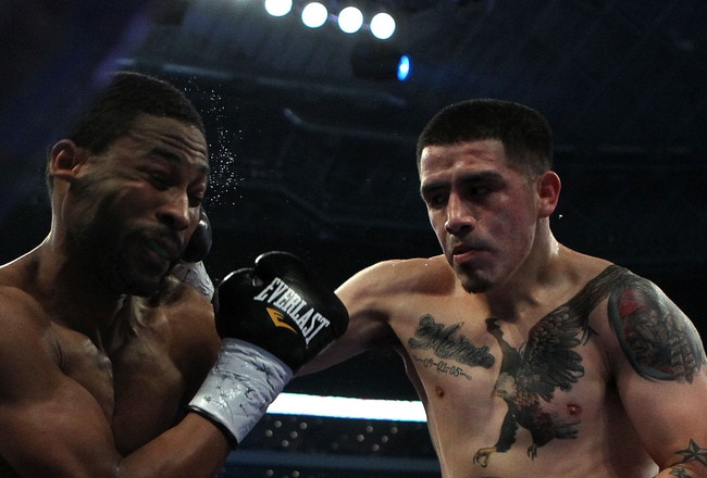 ARLINGTON, TX - NOVEMBER 13:  Brandon Rios (R in brown trunks) lands a punch against Omri Lowther (red trunks) during their Super Lightweight bout at Cowboys Stadium on November 13, 2010 in Arlington, Texas.  (Photo by Nick Laham/Getty Images)