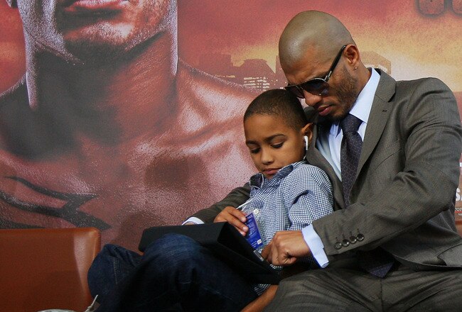 NEW YORK - JUNE 02:  Miguel Cotto and his son Miguel Jr. look on prior to the start of the Foreman v Cotto press conference on June 2, 2010 at Yankee Stadium in the Bronx borough of New York City.  (Photo by Mike Stobe/Getty Images)