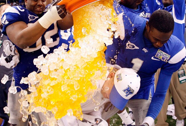 NEW ORLEANS - DECEMBER 20:  Head coach Rick Stockstill is covered with sports drink by Brandon Perry #92 of the Middle Tennessee Blue Raiders after defeating the Southern Miss Golden Eagles 42-32 during the R+L Carriers New Orleans Bowl at the Louisiana Superdome on December 20, 2009 in New Orleans, Louisiana.  (Photo by Chris Graythen/Getty Images)