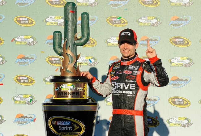 AVONDALE, AZ - FEBRUARY 27:  Jeff Gordon, driver of the #24 Drive to End Hunger Chevrolet, celebrates in victory lane after winning the NASCAR Sprint Cup Series Subway Fresh Fit 500 at Phoenix International Raceway on February 27, 2011 in Avondale, Arizona.  (Photo by Jared C. Tilton/Getty Images for NASCAR)