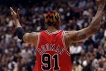 29 Apr 1998:  Dennis Rodman #91 of the Chicago Bulls gestures during a First Round Playoff Game against the New Jersey Nets at the Continental Airlines Arena in East Rutherford, New Jersey. The Bulls defeated the Nets 116-101.