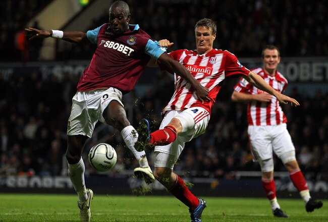 LONDON, ENGLAND - OCTOBER 27: Carlton Cole of West Ham United is challenged by Robert Huth of Stoke City during the Carling Cup fourth round match between West Ham United and Stoke City at Boleyn Ground on October 27, 2010 in London, England.  (Photo by Clive Rose/Getty Images)