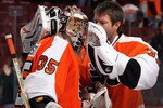 PHILADELPHIA - OCTOBER 26:  Sergei Bobrovsky #35 of the Philadelphia Flyers celebrates with teammate  #33 after defeating the Buffalo Sabres on October 26, 2010 at Wells Fargo Center in Philadelphia, Pennsylvania. The Flyers defeated the Sabres 6-3.  (Photo by Jim McIsaac/Getty Images)