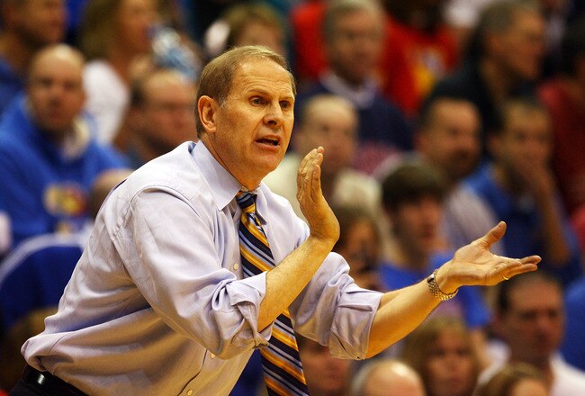 LAWRENCE, KS - DECEMBER 19:  Head coach John Beilein of the Michigan Wolverines watches reacts on the bench during the game against the Kansas Jayhawks on December 19, 2009 at Allen Fieldhouse in Lawrence, Kansas.  (Photo by Jamie Squire/Getty Images)
