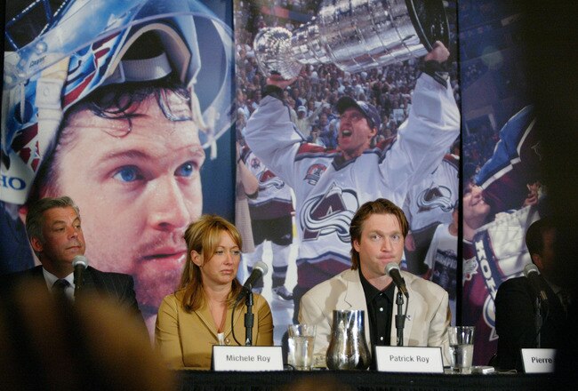 DENVER, CO - MAY 28:  Colorado Avalanche goalie Patrick Roy (R) announces his retirement from the NHL after 18 seasons next to his wife Michele Roy at the Pepsi Center May 28, 2003 in Denver, Colorado. Roy is the NHL's career leader with 551 victories and 1,029 games played, a three-time winner of the Conn Smythe Trophy and a four-time Stanley Cup champion.  (Photo by Tim DeFrisco/Getty Images)