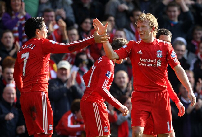 LIVERPOOL, ENGLAND - MARCH 06:  Dirk Kuyt of Liverpool celebrates scoring the opening goal with team mate Luis Suarez during the Barclays Premier League match between Liverpool and Manchester United at Anfield on March 6, 2011 in Liverpool, England.  (Photo by Alex Livesey/Getty Images)