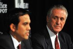 MIAMI - JULY 09:  Head coach Erik Spoelstra (L) and President Pat Riley (R)  of the Miami Heat talk during a press conference after a welcome party for new teammates LeBron James, Dwyane Wade, and Chris Bosh at American Airlines Arena on July 9, 2010 in Miami, Florida.  (Photo by Doug Benc/Getty Images)