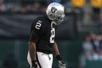 OAKLAND, CA - JANUARY 03:  JaMarcus Russell #2 of the Oakland Raiders walks off the field against the Baltimore Ravens during an NFL game at Oakland-Alameda County Coliseum on January 3, 2010 in Oakland, California.  (Photo by Jed Jacobsohn/Getty Images)