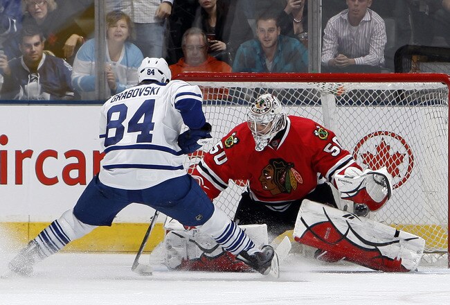 TORONTO, CANADA - MARCH 5: Mikhail Grabovski #84 of the Toronto Maple Leafs gets stopped on a penalty shot by Corey Crawford #50 of the Chicago Blackhawks during game action at the Air Canada Centre March 5, 2011 in Toronto, Ontario, Canada. (Photo by Abelimages/Getty Images)