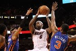 MIAMI, FL - FEBRUARY 27:  LeBron James #6 of the Miami Heat is guarded by Carmelo Anthony #7 and Shawne Williams #3 of the New York Knicks looks on during a game at American Airlines Arena on February 27, 2011 in Miami, Florida. NOTE TO USER: User expressly acknowledges and agrees that, by downloading and/or using this Photograph, User is consenting to the terms and conditions of the Getty Images License Agreement.  (Photo by Mike Ehrmann/Getty Images)