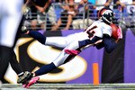 BALTIMORE, MD - OCTOBER 10:  Brandon Lloyd #84 of the Denver Broncos scores a touchdown against the Baltimore Ravens at M&T Bank Stadium on October 10, 2010 in Baltimore, Maryland. Players wore pink in recognition of Breast Cancer Awareness Month. The Ravens lead the Broncos at the half 17-7. (Photo by Larry French/Getty Images)