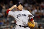 NEW YORK - SEPTEMBER 26:  Daisuke Matsuzaka #18 of the Boston Red Sox delivers a pitch in the first-inning against the New York Yankees on September 26, 2010 at Yankee Stadium in the Bronx borough of New York City.  (Photo by Mike Stobe/Getty Images)