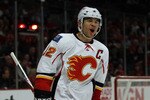 CHICAGO, IL - MARCH 02: Jarome Iginla #12 of the Calgary Flames celebrates a 3rd period goal by teammate Rene Bourque against the Chicago Blackhawks at the United Center on March 2, 2011 in Chicago, Illinois. The Blackhawks defeated the Flames 6-4. (Photo by Jonathan Daniel/Getty Images)