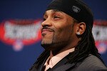 PHOENIX - JANUARY 31:  Defensive back Bob Sanders of the Indianapolis Colts accepts the award for the GMC Defensive Player of the Year award during a news conference prior to Super Bowl XLII at the Phoenix Convention Center on January 31, 2008 in Phoenix, Arizona.  (Photo by Streeter Lecka/Getty Images)
