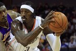 CHARLOTTE, NC - FEBRUARY 14:  Ron Artest #15 of the Los Angeles Lakers reaches for the ball against Gerald Wallace #3 of the Charlotte Bobcats during their game at Time Warner Cable Arena on February 14, 2011 in Charlotte, North Carolina. NOTE TO USER: User expressly acknowledges and agrees that, by downloading and/or using this Photograph, User is consenting to the terms and conditions of the Getty Images License Agreement.  (Photo by Streeter Lecka/Getty Images)