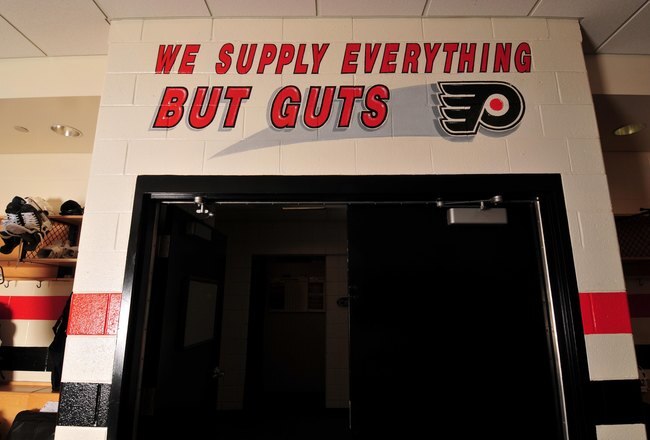 VOORHEES, NJ - AUGUST 26:  A view of the motto 'We Supply Everything But Guts' on the interior wall of the Philadelphia Flyers locker room at the Virtua Center Flyers Skate Zone training facility on August 26, 2009 in Voorhees, New Jersey. (Photo by Norman Y. Lono/Getty Images)