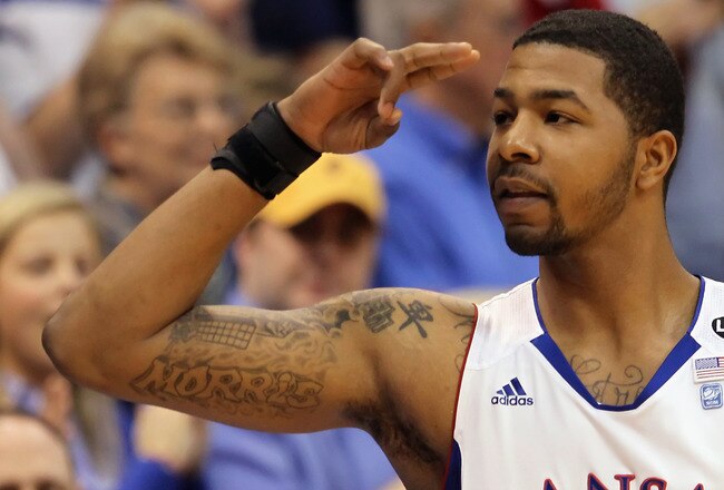 LAWRENCE, KS - MARCH 02:  Markieff Morris #21 of the Kansas Jayhawks salutes the crowd prior to the start of the game against the Texas A&M Aggies on March 2, 2011 at Allen Fieldhouse in Lawrence, Kansas.  (Photo by Jamie Squire/Getty Images)