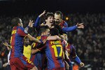 BARCELONA, SPAIN - MARCH 08:  Lionel Messi of FC Barcelona (C) celebrates with his teammates after scoring his second goal during the UEFA Champions League round of 16 second leg match between Barcelona and Arsenal at the Camp Nou stadium on March 8, 2011 in Barcelona, Spain.  (Photo by David Ramos/Getty Images)