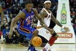 CLEVELAND - FEBRUARY 25:  Toney Douglas #23 of the New York Knicks and Daniel Gibson #1 of the Cleveland Cavaliers fight for a loose ball during the game on February 25, 2011 at Quicken Loans Arena in Cleveland, Ohio. NOTE TO USER: User expressly acknowledges and agrees that, by downloading and/or using this Photograph, user is consenting to the terms and conditions of the Getty Images License Agreement.  (Photo by Jared Wickerham/Getty Images)