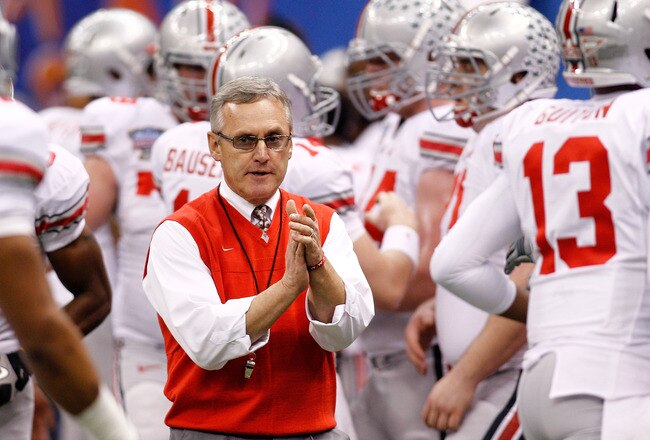 NEW ORLEANS, LA - JANUARY 04:  Head coach Jim Tressel of the Ohio State Buckeyes gathers his team before the Allstate Sugar Bowl against the Arkansas Razorbacks at the Louisiana Superdome on January 4, 2011 in New Orleans, Louisiana.  (Photo by Chris Graythen/Getty Images)