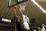 WEST LAFAYETTE, IN - JANUARY 09: Bryce Cartwright #24 of the Iowa Hawkeyes drives for a shot attempt against E'Twaun Moore #33 of the Purdue Boilermakers during the Big Ten Conference game at Mackey Arena on January 9, 2011 in West Lafayette, Indiana.  (Photo by Andy Lyons/Getty Images)